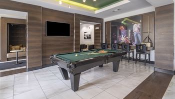 a billiards table in a game room with a tv at The Hendrix, Georgia, 30329